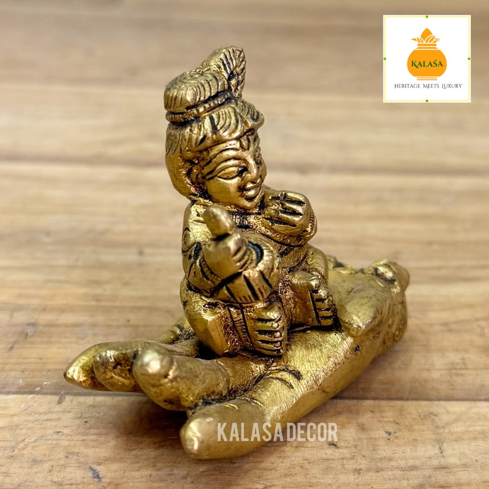 Brass Little Krishna on Hand – Unique Devotional Showpiece | Bal Krishna Brass Idol (2.25 Inch)
