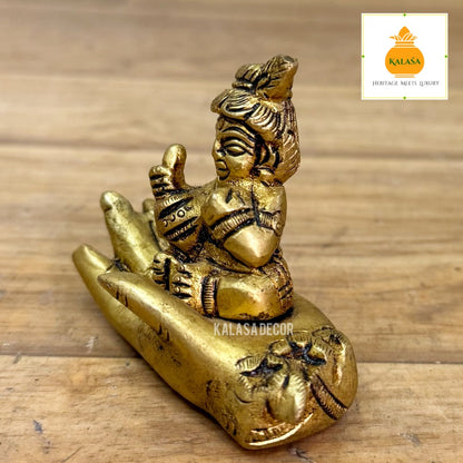 Brass Little Krishna on Hand – Unique Devotional Showpiece | Bal Krishna Brass Idol (2.25 Inch)